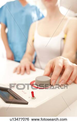 Stock Photograph - Iontophoresis. This is a treatment for excess sweating.. Fotosearch