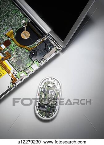 Stock Image - Laptop and mouse interior.. Fotosearch