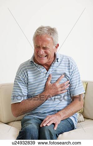 Man having a heart attack. View Large Photo Image Stock Photo - Man having a heart attack.. Fotosearch
