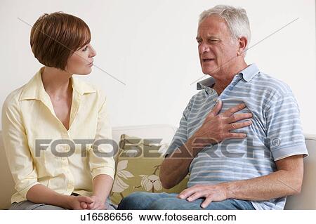 Stock Photograph - Man having a heart attack.. Fotosearch