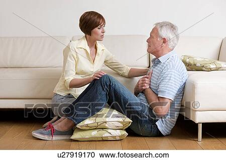 Man having a heart attack. The woman is placing him in a comfortable position until help comes. View Large Photo Image Stock Image - Man having a heart attack. The woman is placing him in a comfortable position until help comes.. Fotosearch