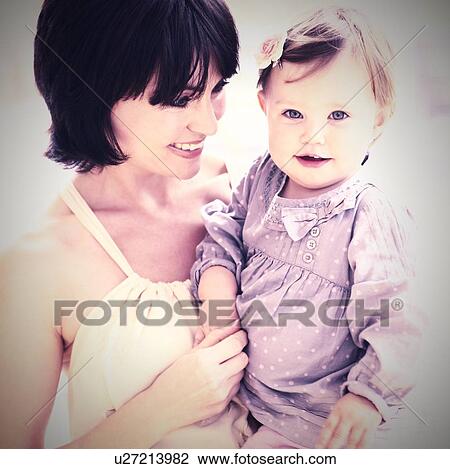 Mother and daughter. Mother holding her 15 month old daughter. View Large Photo Image Stock Image - Mother and daughter. Mother holding her 15 month old daughter.. Fotosearch