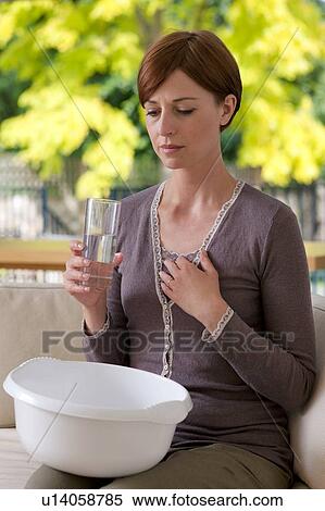 Nausea. Woman feeling sick. View Large Photo Image Stock Photography - Nausea. Woman feeling sick.. Fotosearch