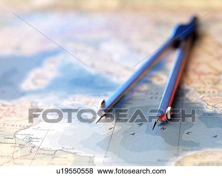 Stock Photo - Navigation. Dividers sitting on a map.. Fotosearch