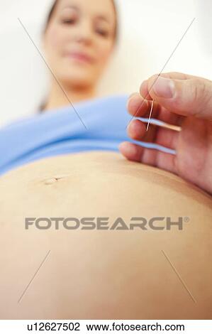 Obstetric examination. Midwife performing a prick test on a pregnant woman at a birthing centre. View Large Photo Image Stock Image - Obstetric examination. Midwife performing a prick test on a pregnant woman at a birthing centre.. Fotosearch