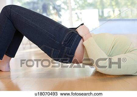 Overweight woman struggling to do her jeans up. View Large Photo Image Stock Image - Overweight woman struggling to do her jeans up.. Fotosearch