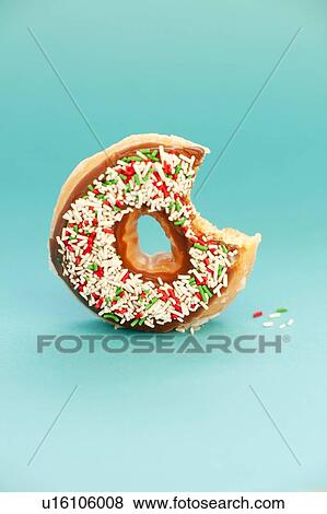 Stock Photo - Part-eaten doughnut.. Fotosearch