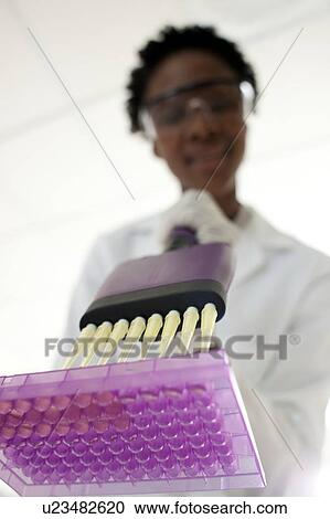 Pipetting. View Large Photo Image Stock Image - Pipetting.. Fotosearch