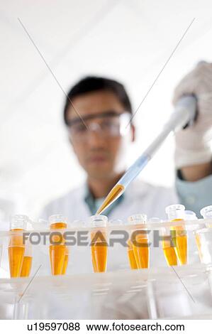 Stock Photo - Pipetting.. Fotosearch