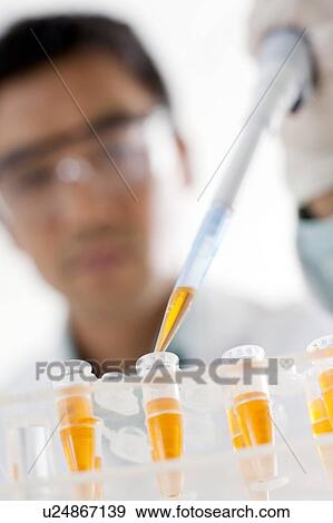 Stock Photo - Pipetting.. Fotosearch