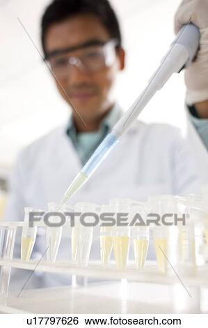Pipetting. View Large Photo Image Stock Photograph - Pipetting.. Fotosearch