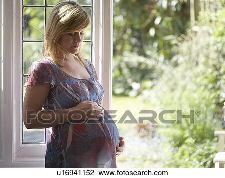 Pregnant woman. She is 35 weeks pregnant. View Large Photo Image Stock Image - Pregnant woman. She is 35 weeks pregnant.. Fotosearch