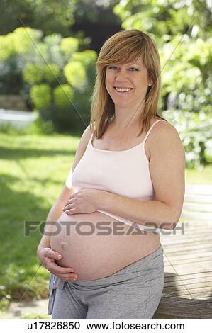Pregnant woman. She is 35 weeks pregnant. View Large Photo Image Stock Image - Pregnant woman. She is 35 weeks pregnant.. Fotosearch