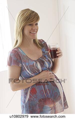 Pregnant woman. She is 35 weeks pregnant. View Large Photo Image Stock Photo - Pregnant woman. She is 35 weeks pregnant.. Fotosearch