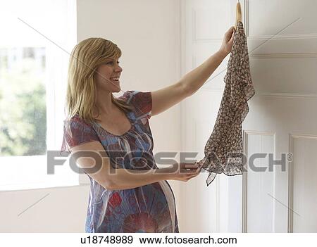 Stock Photo - Pregnant woman. She is 35 weeks pregnant.. Fotosearch