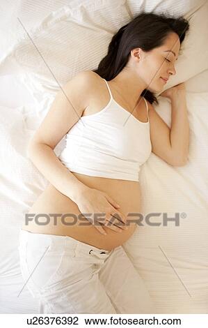 Pregnant woman sleeping. View Large Photo Image Stock Image - Pregnant woman sleeping.. Fotosearch