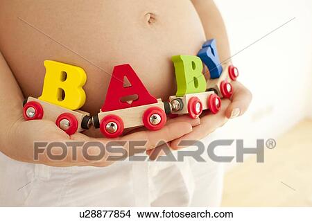 Pregnant woman's abdomen. View Large Photo Image Picture - Pregnant woman's abdomen.. Fotosearch