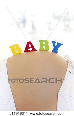 Pregnant woman's abdomen. View Large Photo Image Stock Image - Pregnant woman's abdomen.. Fotosearch