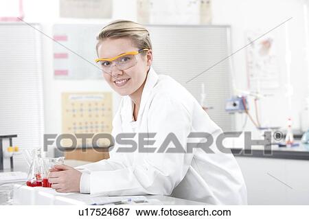 Stock Photo - Pupil in a science lesson.. Fotosearch