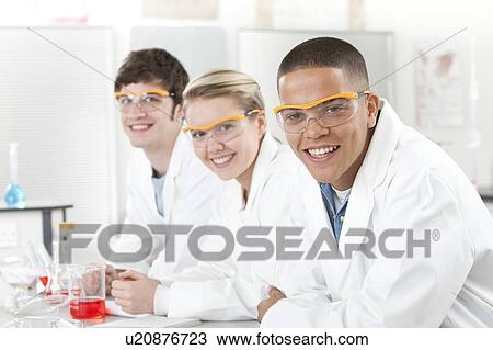 Stock Image - Pupils in a science lesson.. Fotosearch