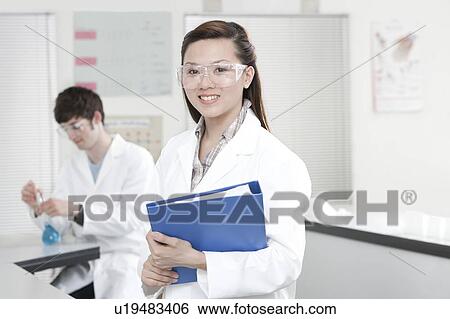 Stock Photograph - Pupils in a science lesson.. Fotosearch