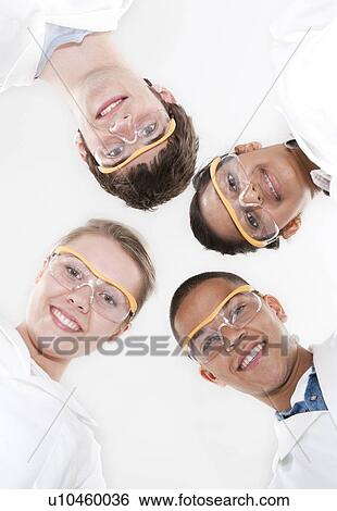 Pupils wearing safety goggles and lab coats. View Large Photo Image Stock Photograph - Pupils wearing safety goggles and lab coats.. Fotosearch