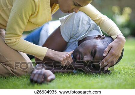 Recovery position. Man being placed in the recovery position. View Large Photo Image Stock Photography - Recovery position. Man being placed in the recovery position.. Fotosearch