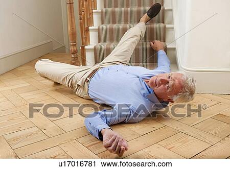 Stock Image - Senior man injured in a fall.. Fotosearch