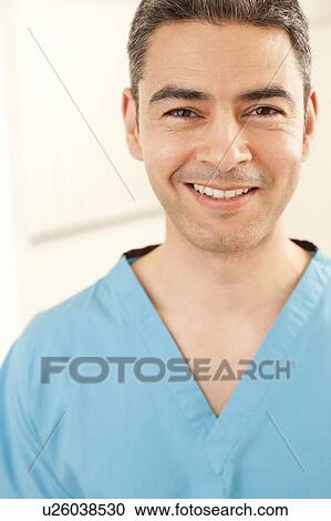 Stock Image - Smiling doctor.. Fotosearch
