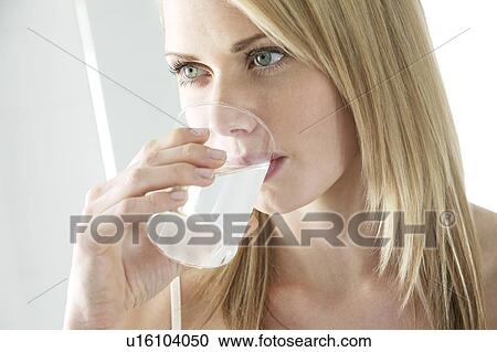 Soluble painkiller. Woman drinking a soluble pain killer. View Large Photo Image Stock Image - Soluble painkiller. Woman drinking a soluble pain killer.. Fotosearch