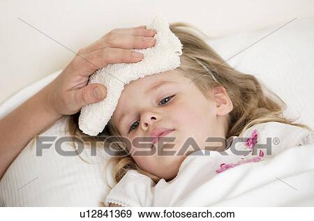 Soothing a child's fever. View Large Photo Image Stock Photo - Soothing a child's fever.. Fotosearch