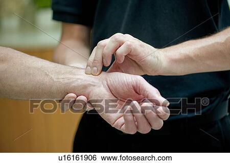 Taking a pulse. View Large Photo Image Stock Photograph - Taking a pulse.. Fotosearch