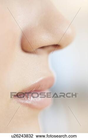 Stock Image - Teenage girl's mouth and nose.. Fotosearch