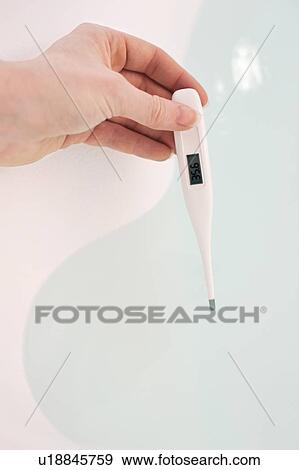 Testing water temperature. View Large Photo Image Stock Photo - Testing water temperature.. Fotosearch