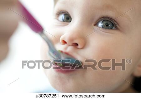 toddler eating spoon