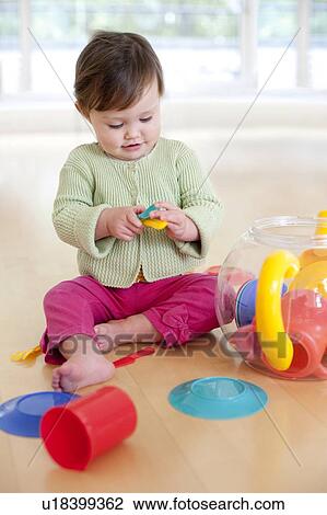 Toddler playing. She is 15 months old. View Large Photo Image Stock Image - Toddler playing. She is 15 months old.. Fotosearch