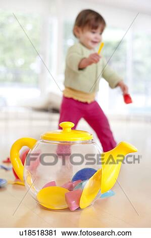 Stock Image - Toddler playing. She is 15 months old.. Fotosearch