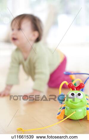 Toddler playing. She is 15 months old. View Large Photo Image Stock Photo - Toddler playing. She is 15 months old.. Fotosearch