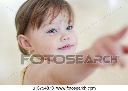 Toddler pointing. 15 month old girl pointing. View Large Photo Image Stock Image - Toddler pointing. 15 month old girl pointing.. Fotosearch