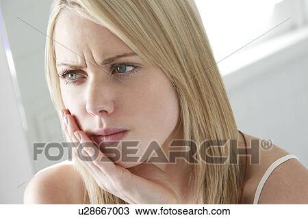 Toothache. Woman holding her jaw. View Large Photo Image Stock Image - Toothache. Woman holding her jaw.. Fotosearch