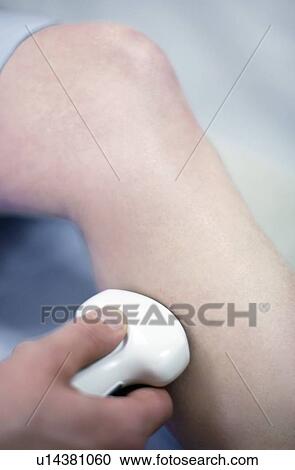 Ultrasound scan. Woman having an ultrasound scan of her leg. View Large Photo Image Stock Image - Ultrasound scan. Woman having an ultrasound scan of her leg.. Fotosearch