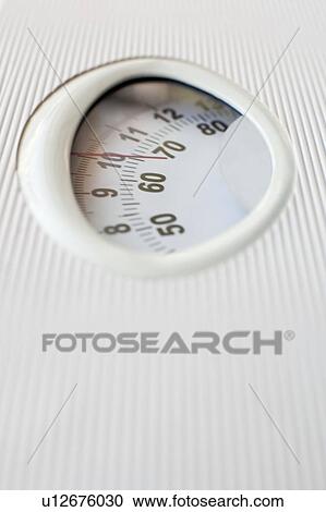 Stock Image - Weight measurement, close-up.. Fotosearch