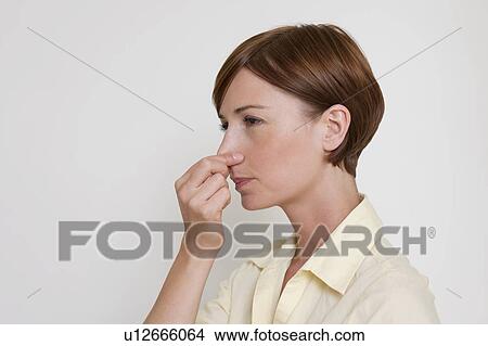 Picture - Woman holding her breath.. Fotosearch