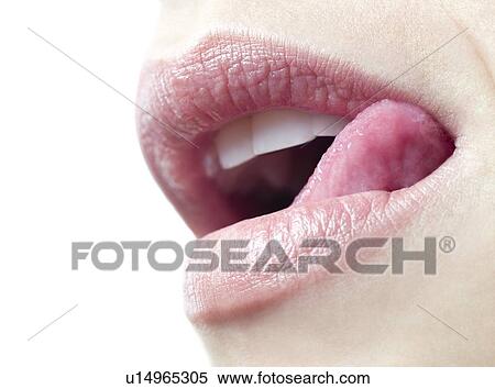 Woman licking her lips. View Large Photo Image Stock Photography - Woman licking her lips.. Fotosearch