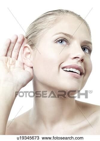 Stock Image - Woman listening.. Fotosearch
