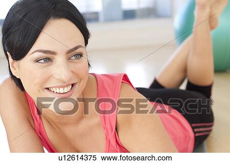 Stock Photography - Woman resting after exercise.. Fotosearch