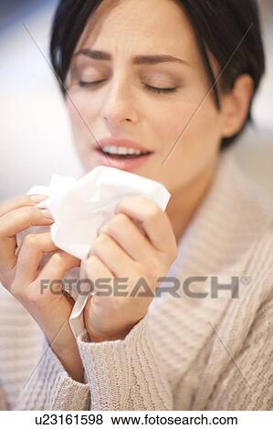 Stock Photo - Woman sneezing.. Fotosearch