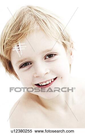 Young boy with head wound. The wound is closed with steri-strips. View Large Photo Image Stock Photography - Young boy with head wound. The wound is closed with steri-strips.. Fotosearch