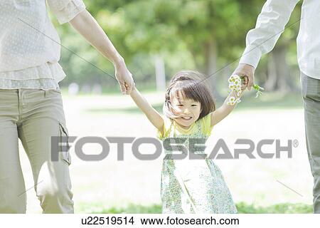 A family holding hands View Large Photo Image Picture - A family holding hands. Fotosearch