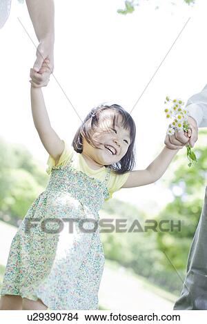A family holding hands View Large Photo Image Picture - A family holding hands. Fotosearch